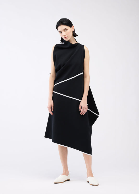 A model wears the 132 5. ISSEY MIYAKE HALF CUBE PATTERN KNIT dress.