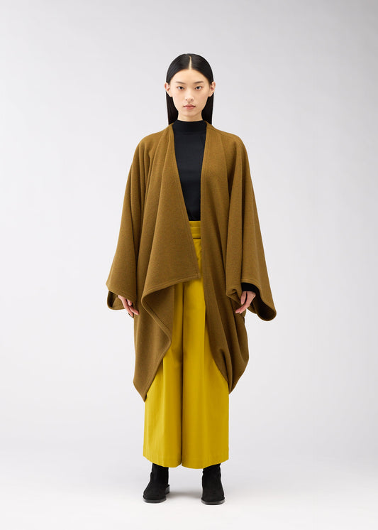 A model wears the 132 5. ISSEY MIYAKE DRAPE COAT coat.