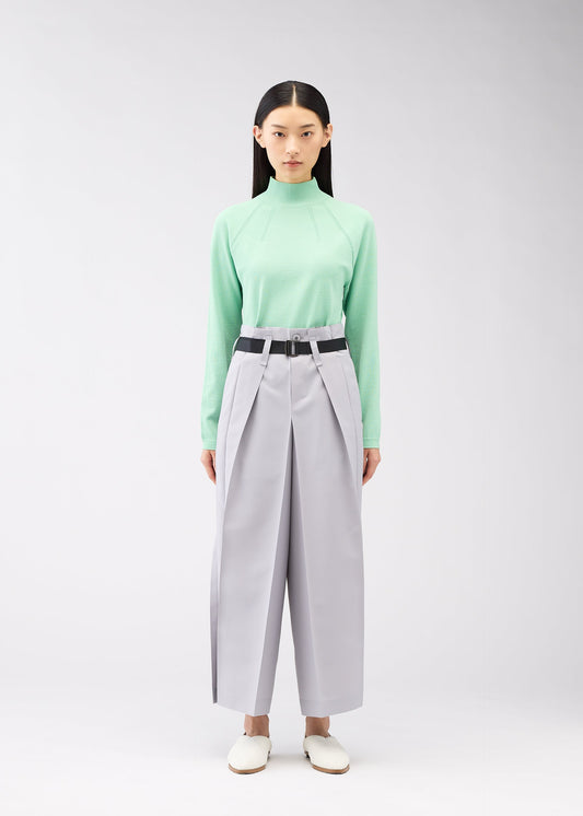 A model wears the 132 5. ISSEY MIYAKE FLAT SQUARE BOTTOMS trousers.