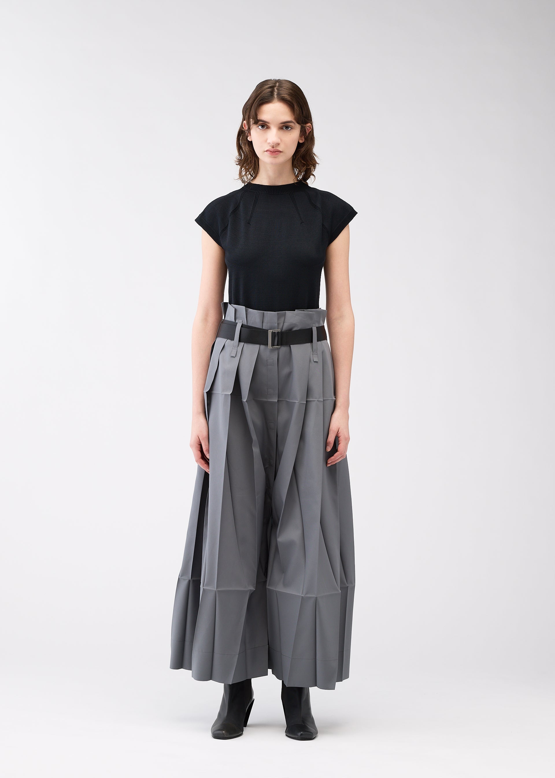 A model wears the 132 5. ISSEY MIYAKE NO.3 trousers.