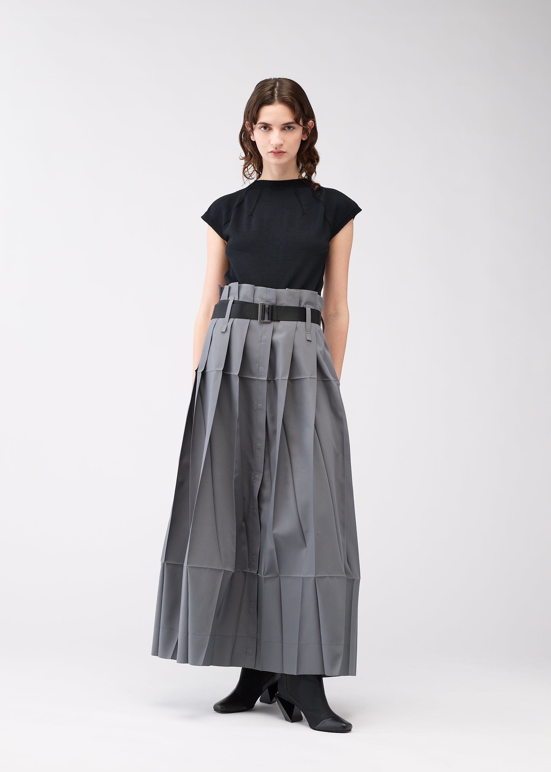 A model wears the 132 5. ISSEY MIYAKE NO.3 trousers.