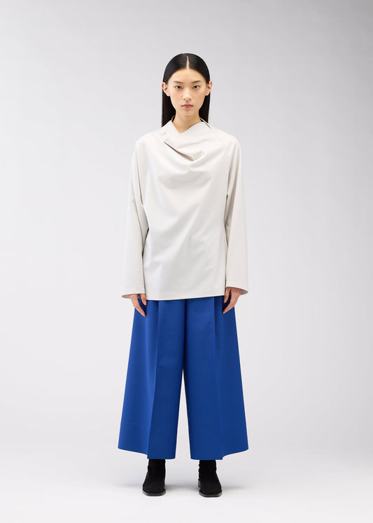 A model wears the 132 5. ISSEY MIYAKE CLEANCUT WOOL clothing.