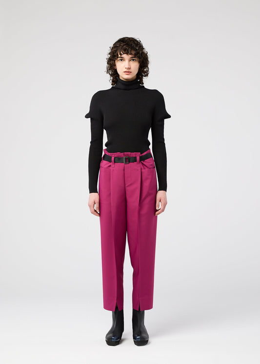A model wears the 132 5. ISSEY MIYAKE 132 5. FLAT 1 trousers.