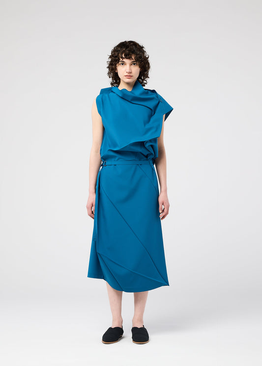 A model wears the 132 5. ISSEY MIYAKE FACET SOLID dress.