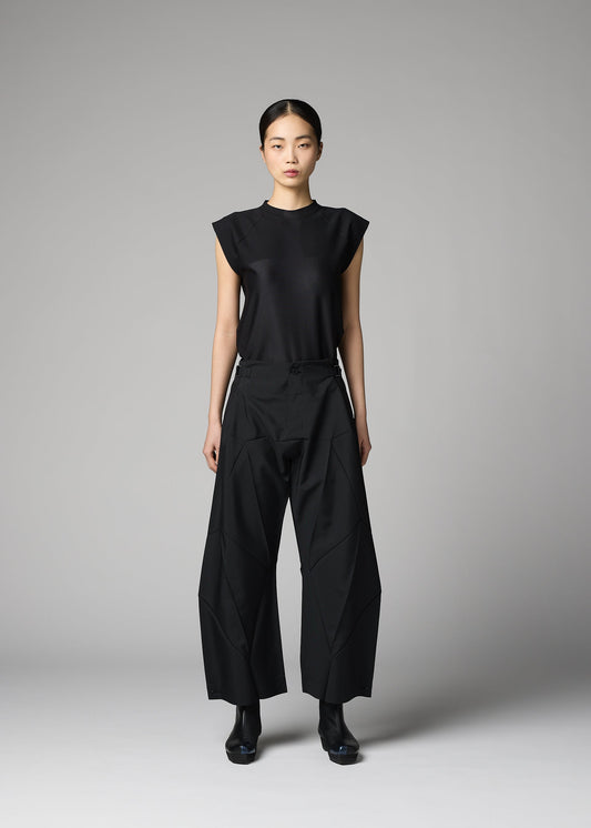 A model wears the 132 5. ISSEY MIYAKE F-BT trousers.