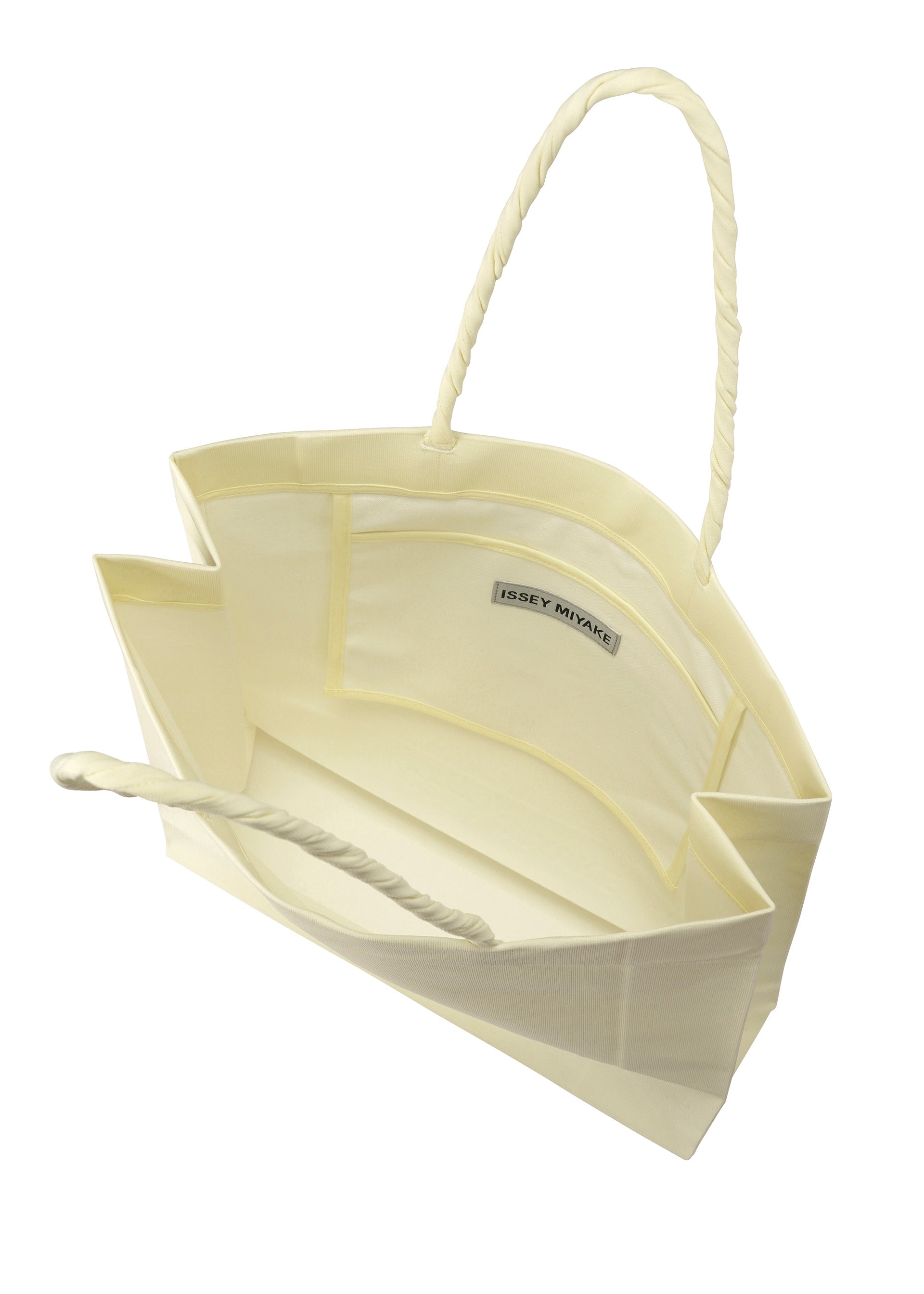 A detail shot of the ISSEY MIYAKE PAPER BAG bag.