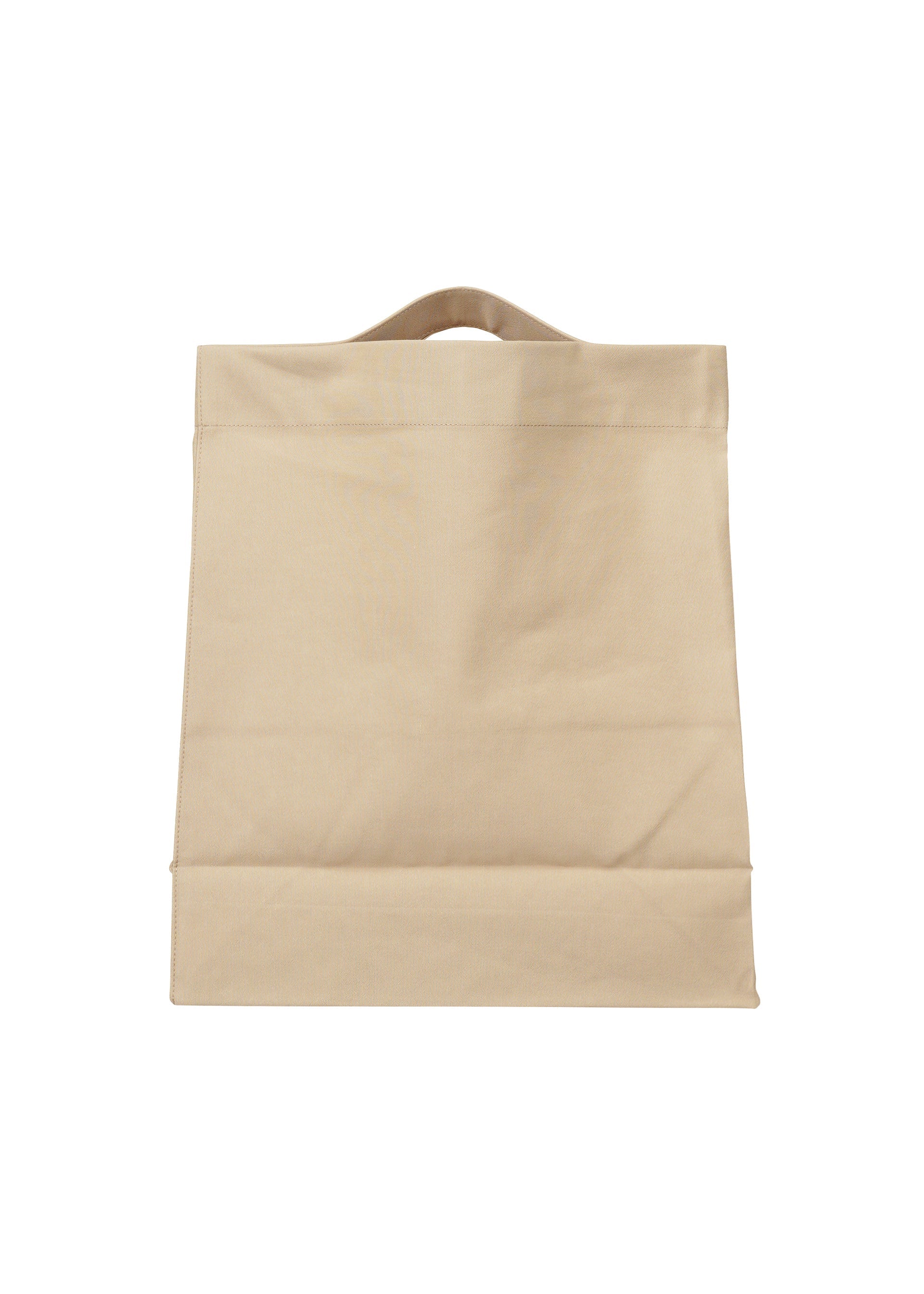 A detail shot of the ISSEY MIYAKE DRAWN AND PRESSED bag.