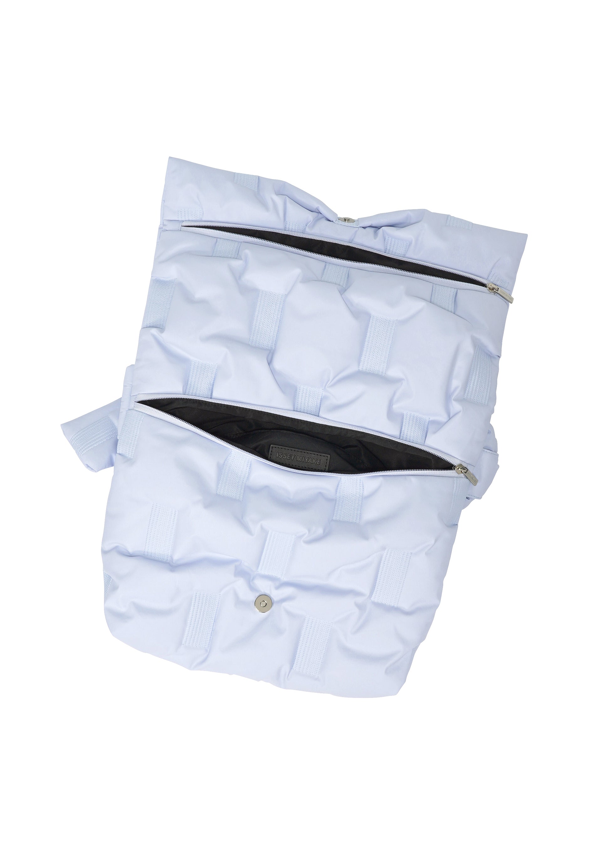 A detail shot of the ISSEY MIYAKE SQUARE CUSHION bag.