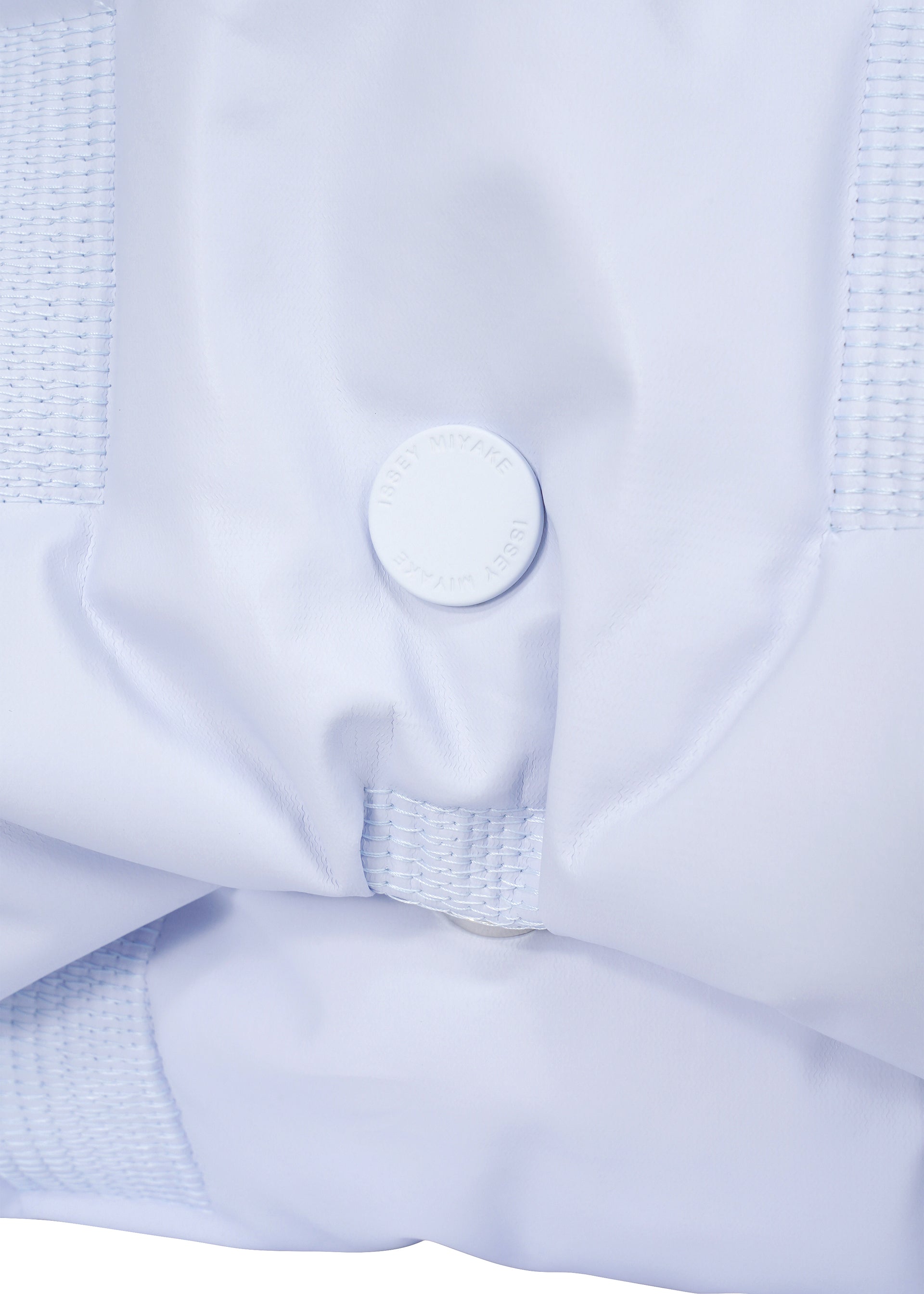 A detail shot of the ISSEY MIYAKE SQUARE CUSHION bag.
