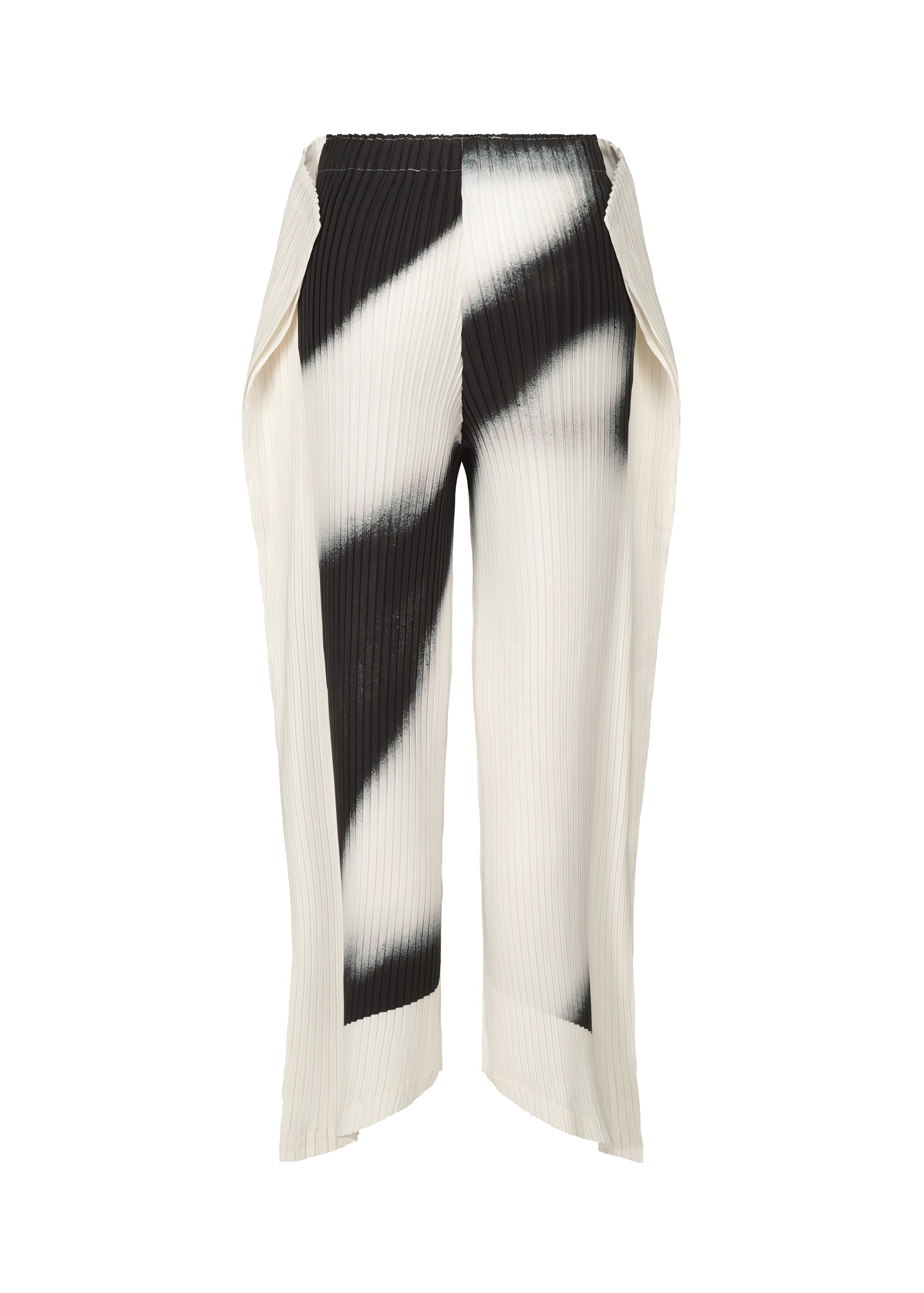 A detail shot of the ISSEY MIYAKE SHADOW STUDY PLEATS trousers.