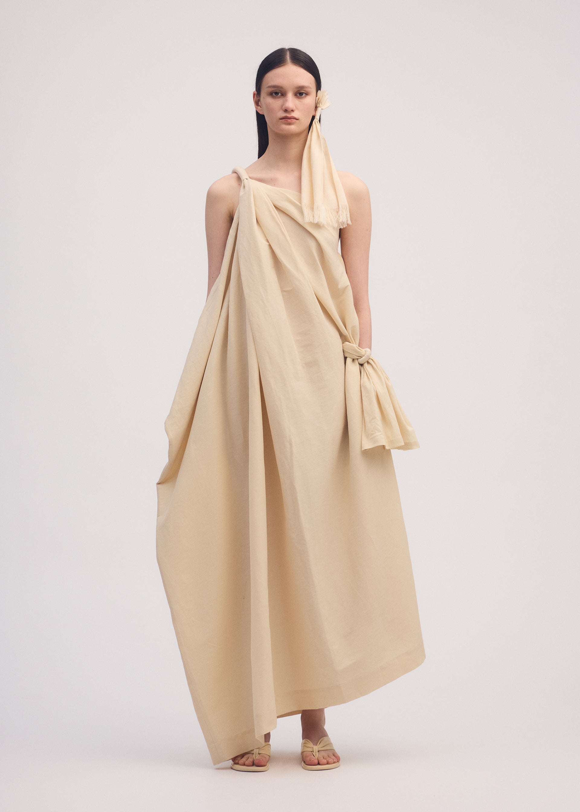 A model wears the ISSEY MIYAKE CLOTH AND CORD dress.