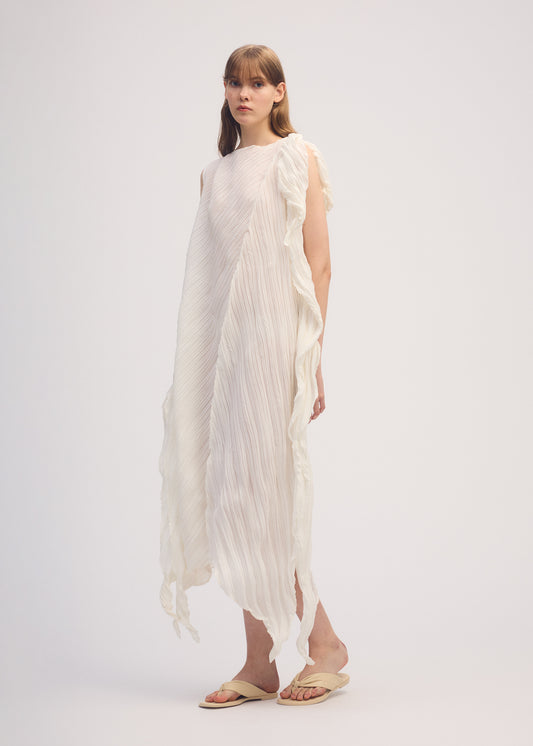 A model wears the ISSEY MIYAKE WRINKLED AND TWISTED dress.