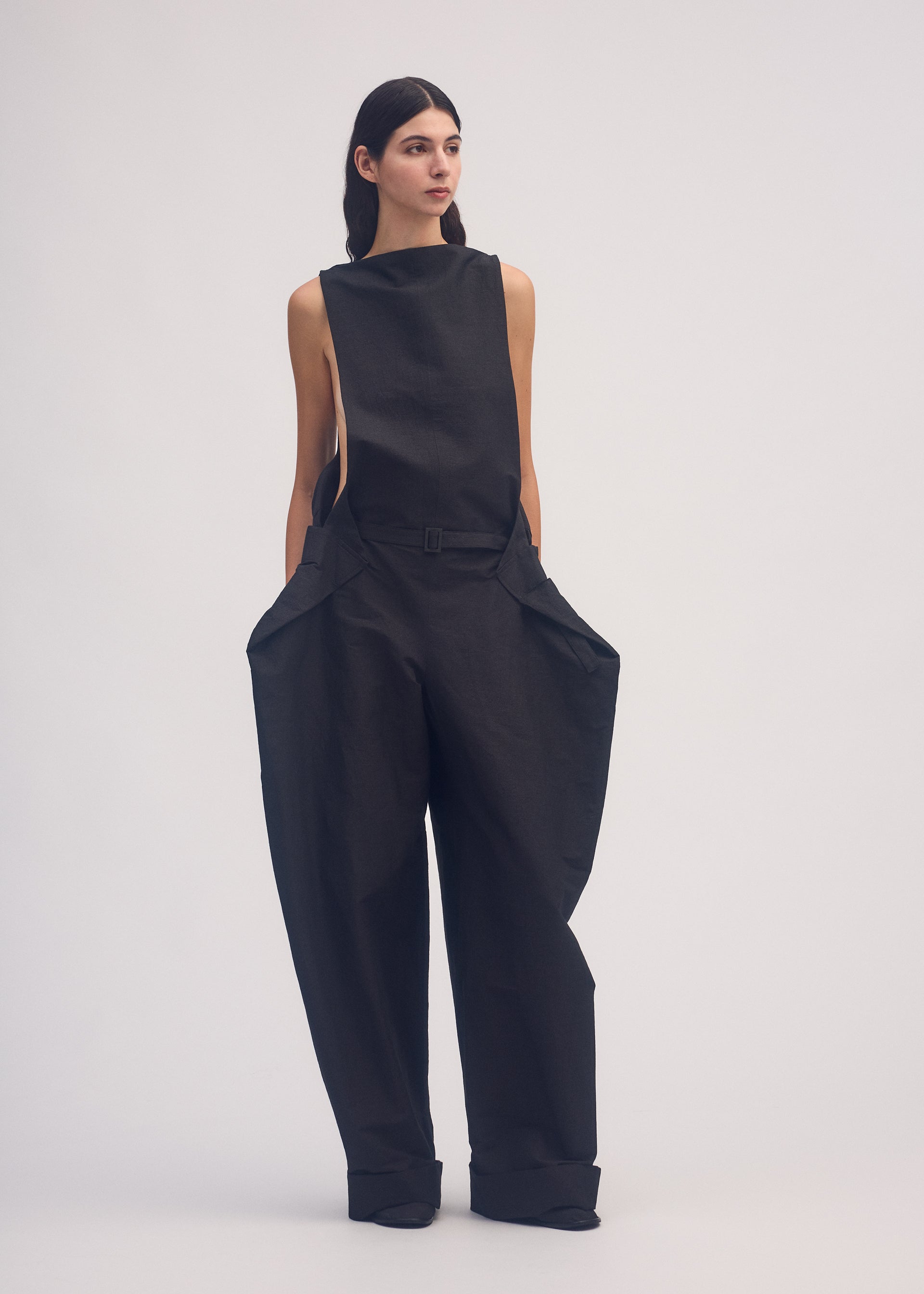 A model wears the ISSEY MIYAKE FOLD TO FORM jumpsuit.