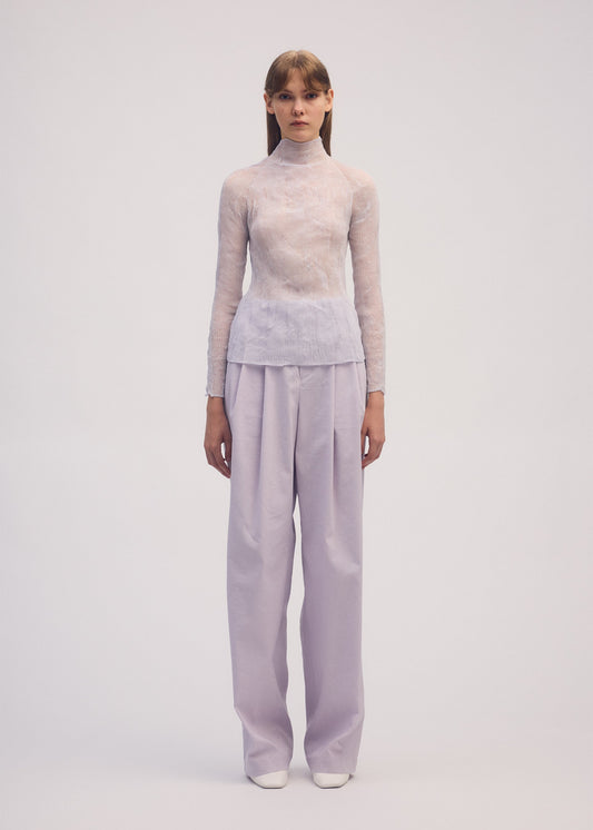 A model wears the ISSEY MIYAKE CHIFFON TWIST 1 shirt.