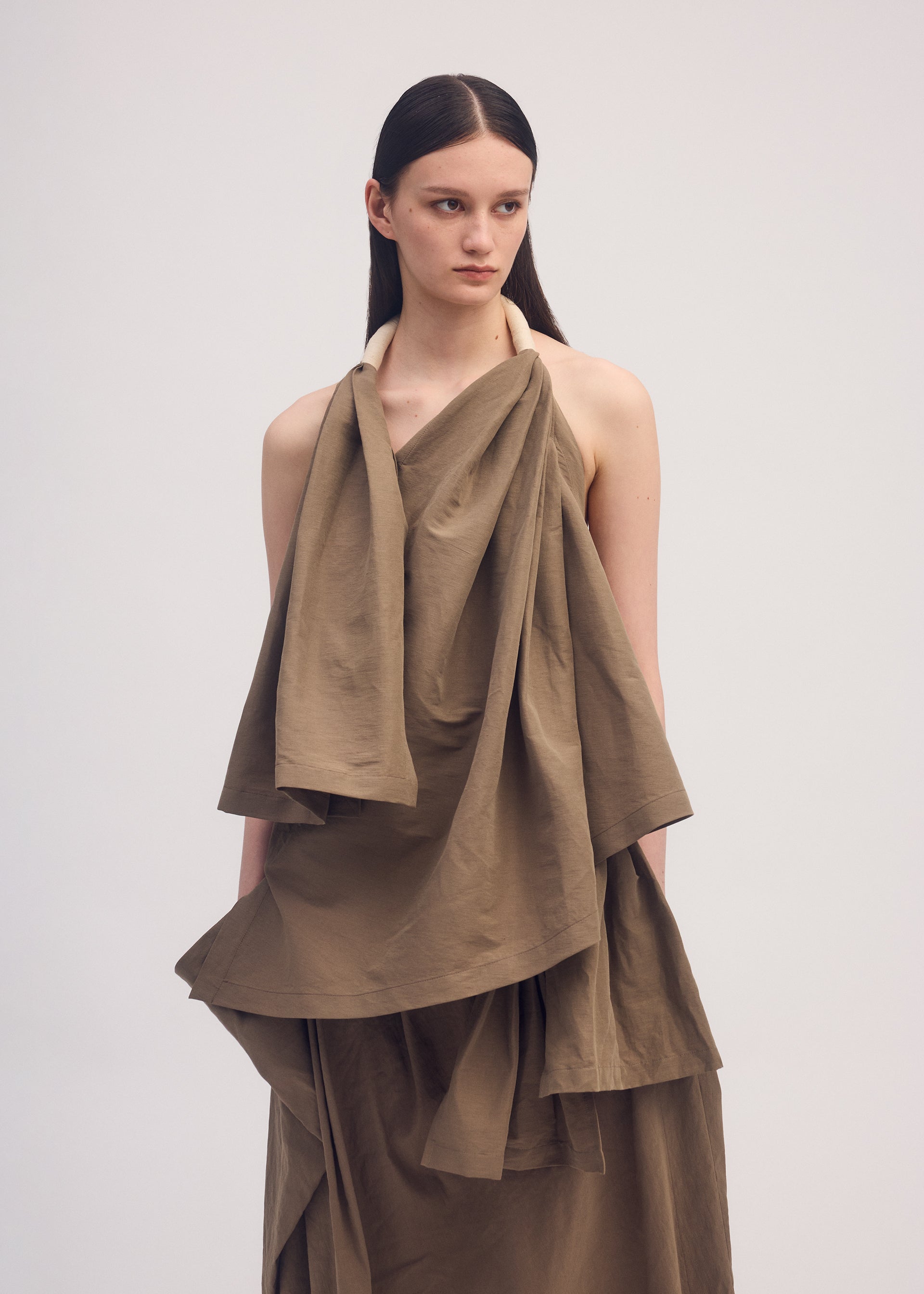 A model wears the ISSEY MIYAKE CLOTH AND CORD shirt.