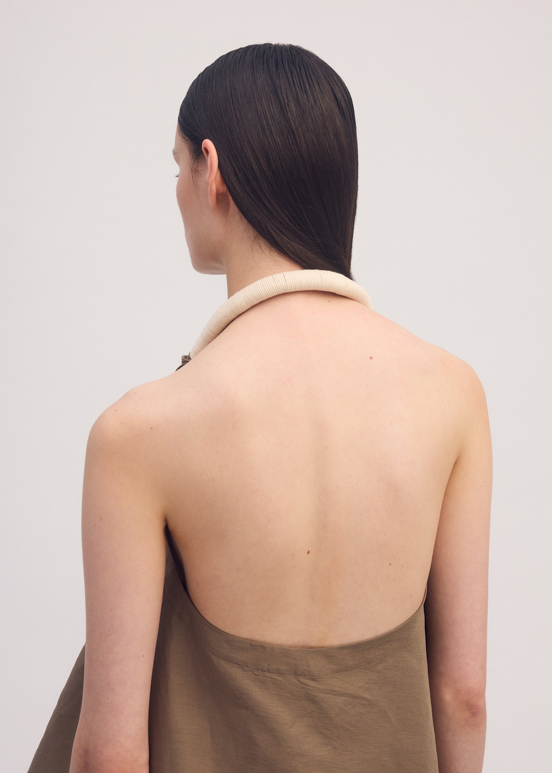 A model wears the ISSEY MIYAKE CLOTH AND CORD shirt.