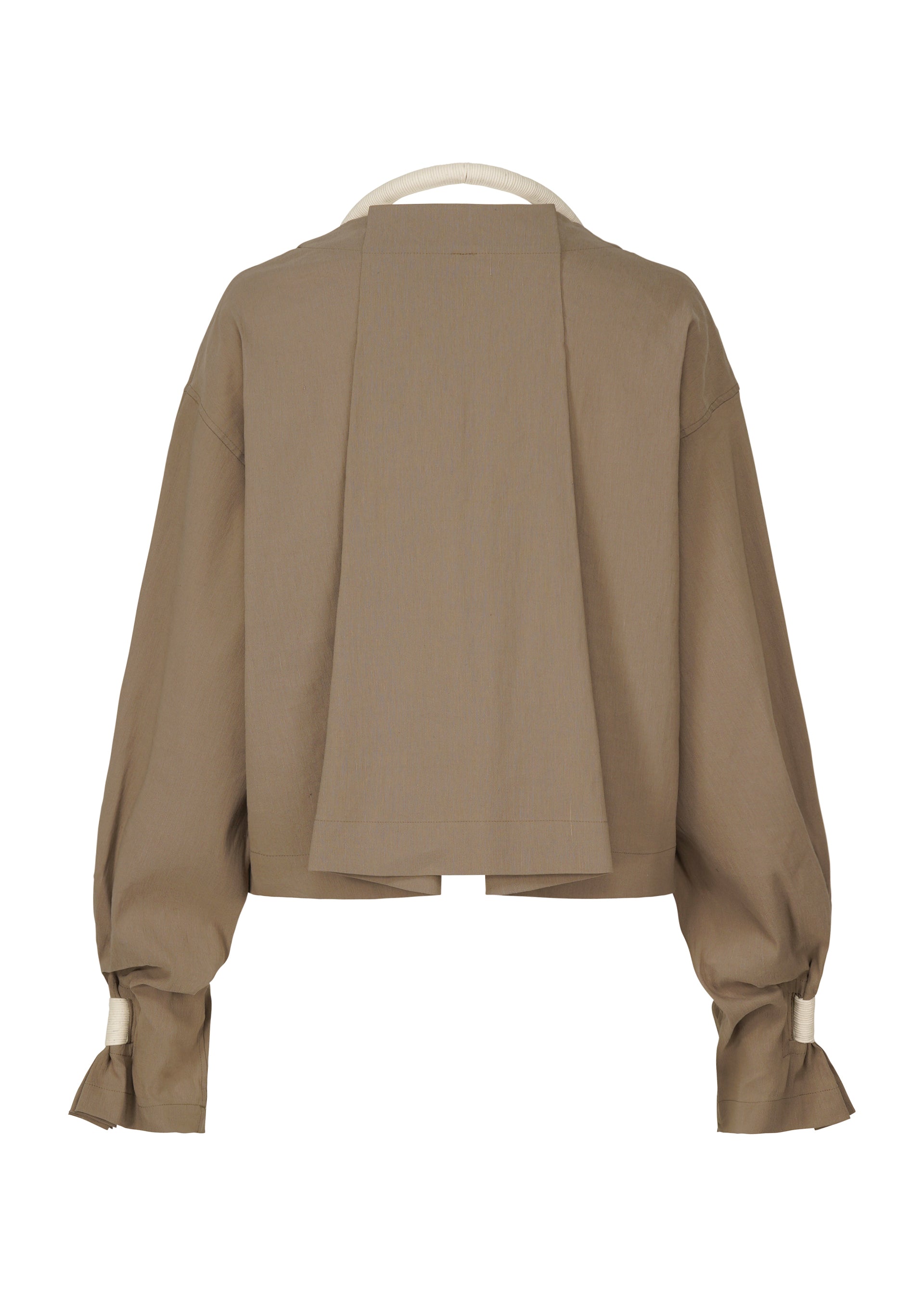 A detail shot of the ISSEY MIYAKE CLOTH AND CORD cardigan.