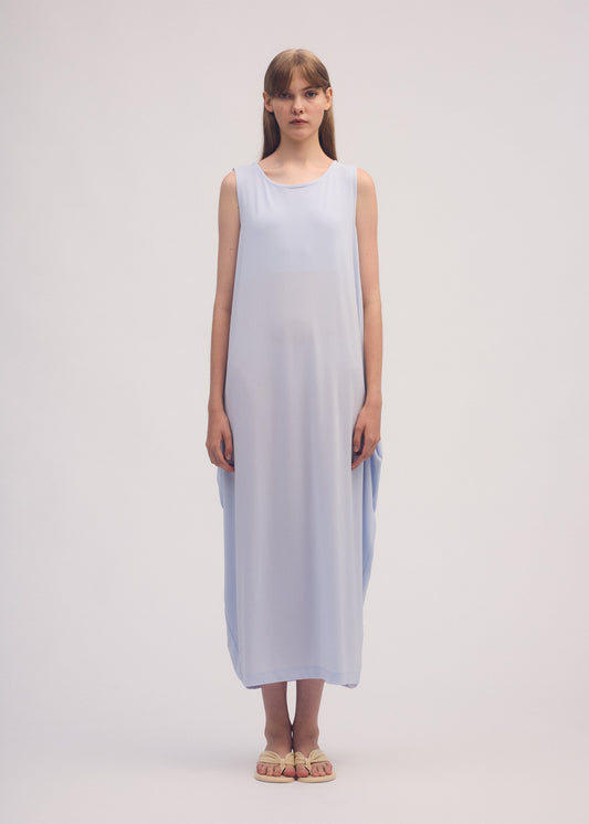 A model wears the ISSEY MIYAKE DRAPE JERSEY 56 dress.