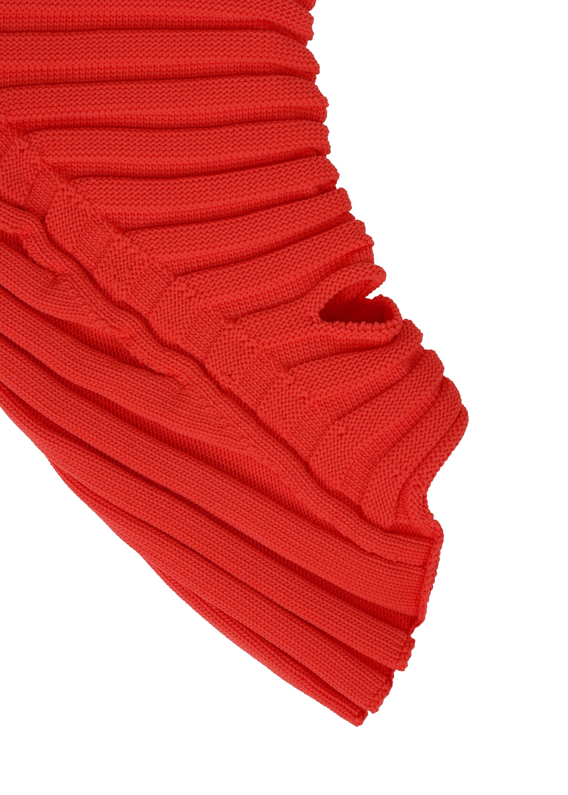 A detail shot of the ISSEY MIYAKE KNIT (AS IT IS) ACC gloves.