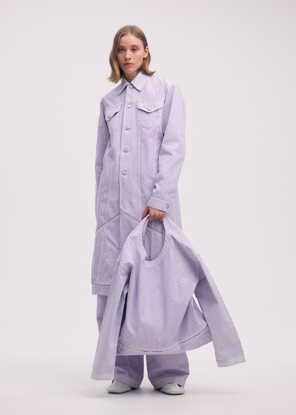 A model wears the ISSEY MIYAKE SCULPTURAL (BAG) bag.