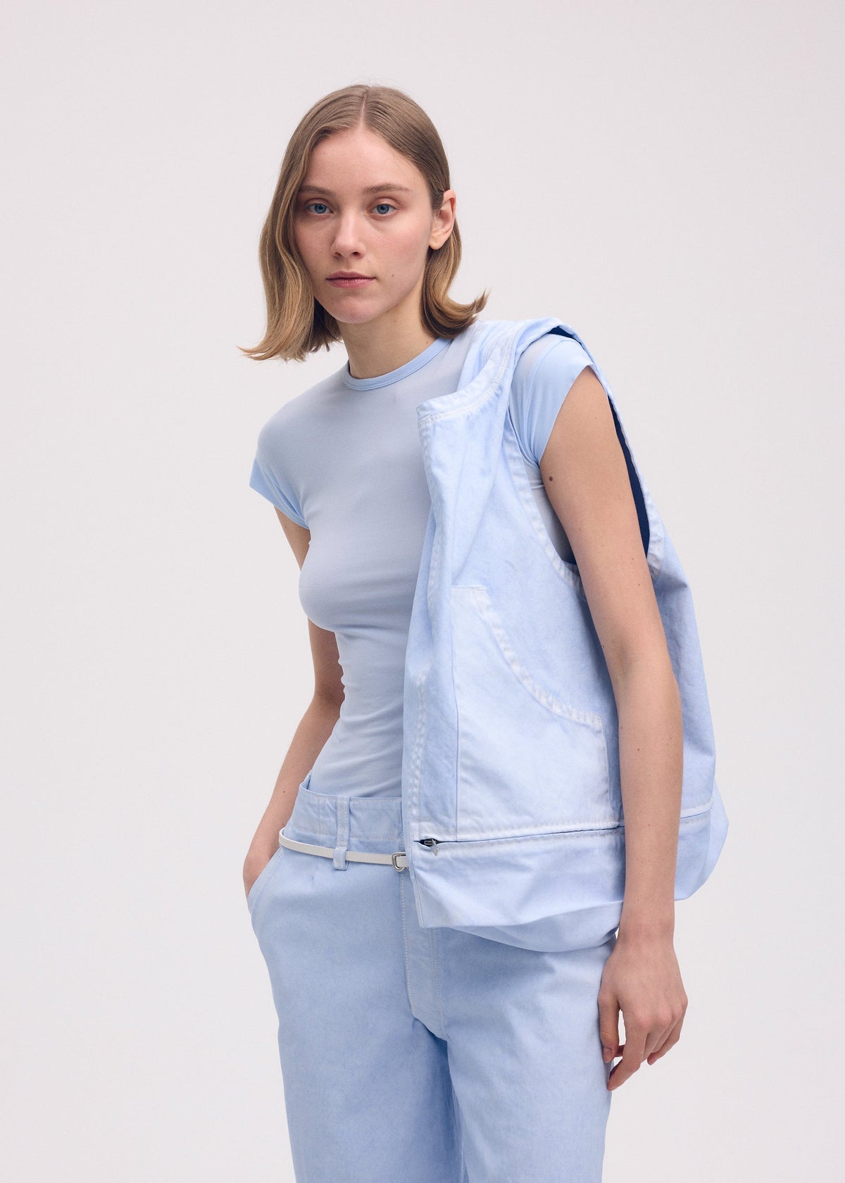 A model wears the ISSEY MIYAKE SCULPTURAL (BAG) bag.