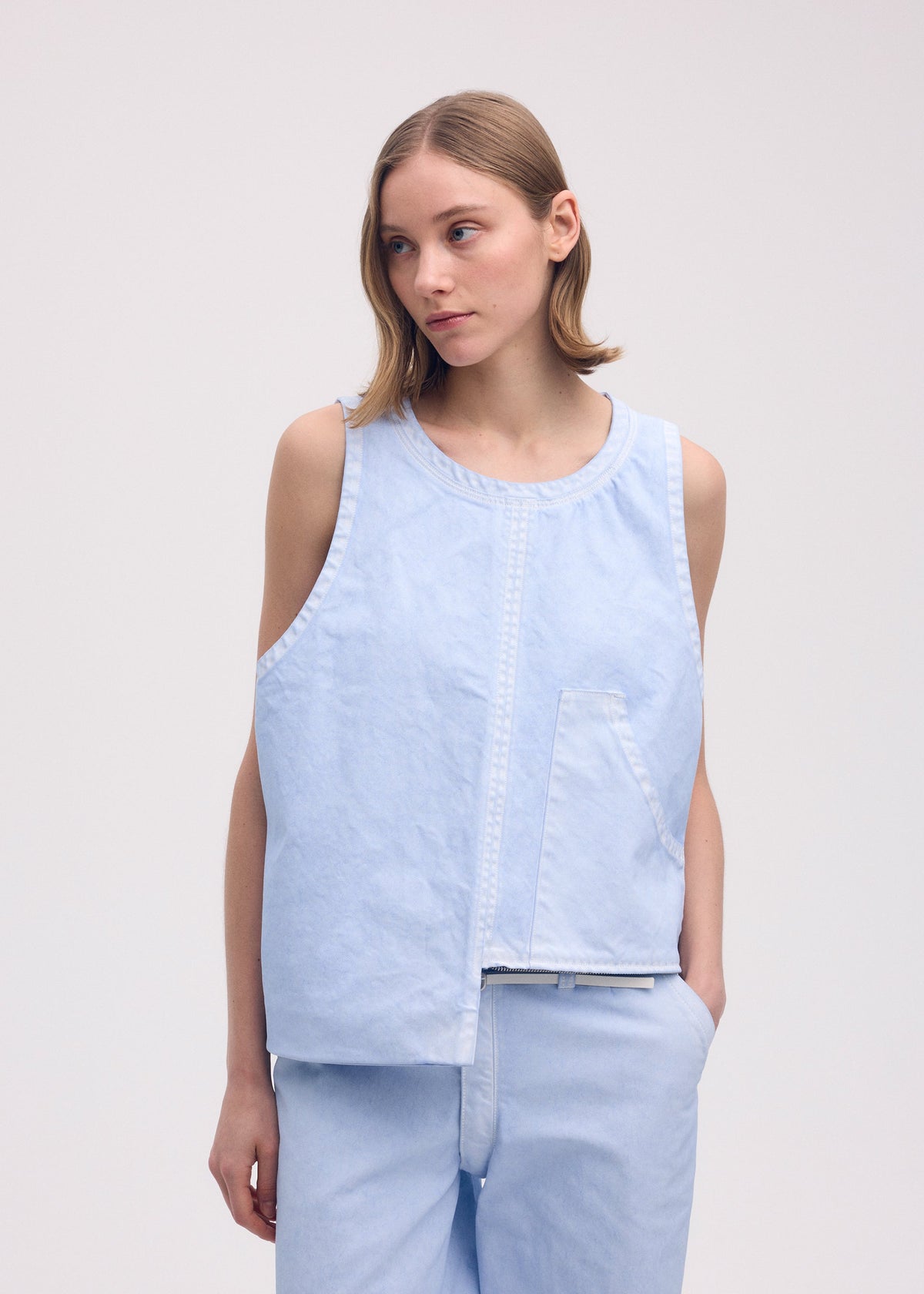 A model wears the ISSEY MIYAKE SCULPTURAL (BAG) bag.