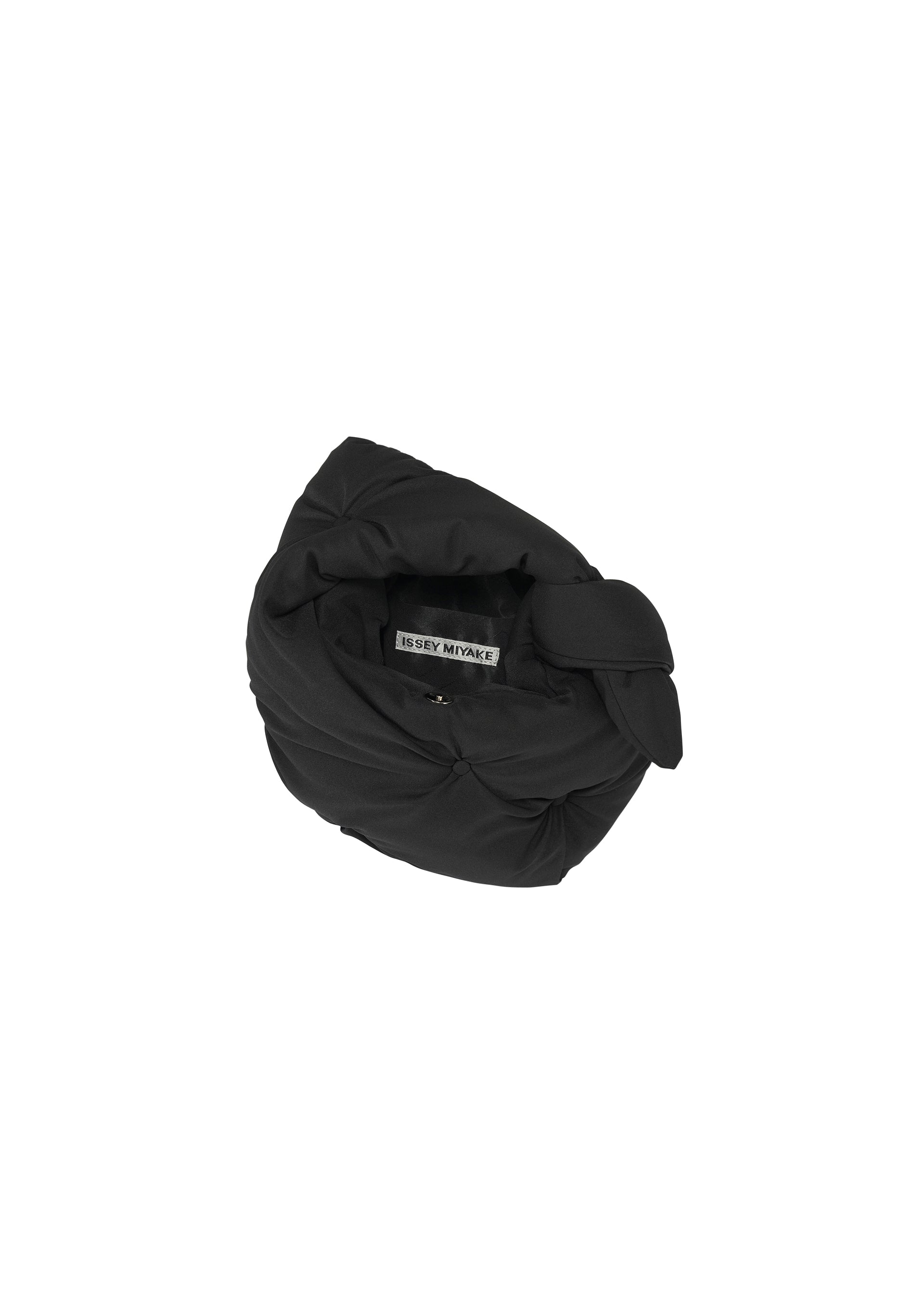 A detail shot of the ISSEY MIYAKE PUMPED BAG bag.