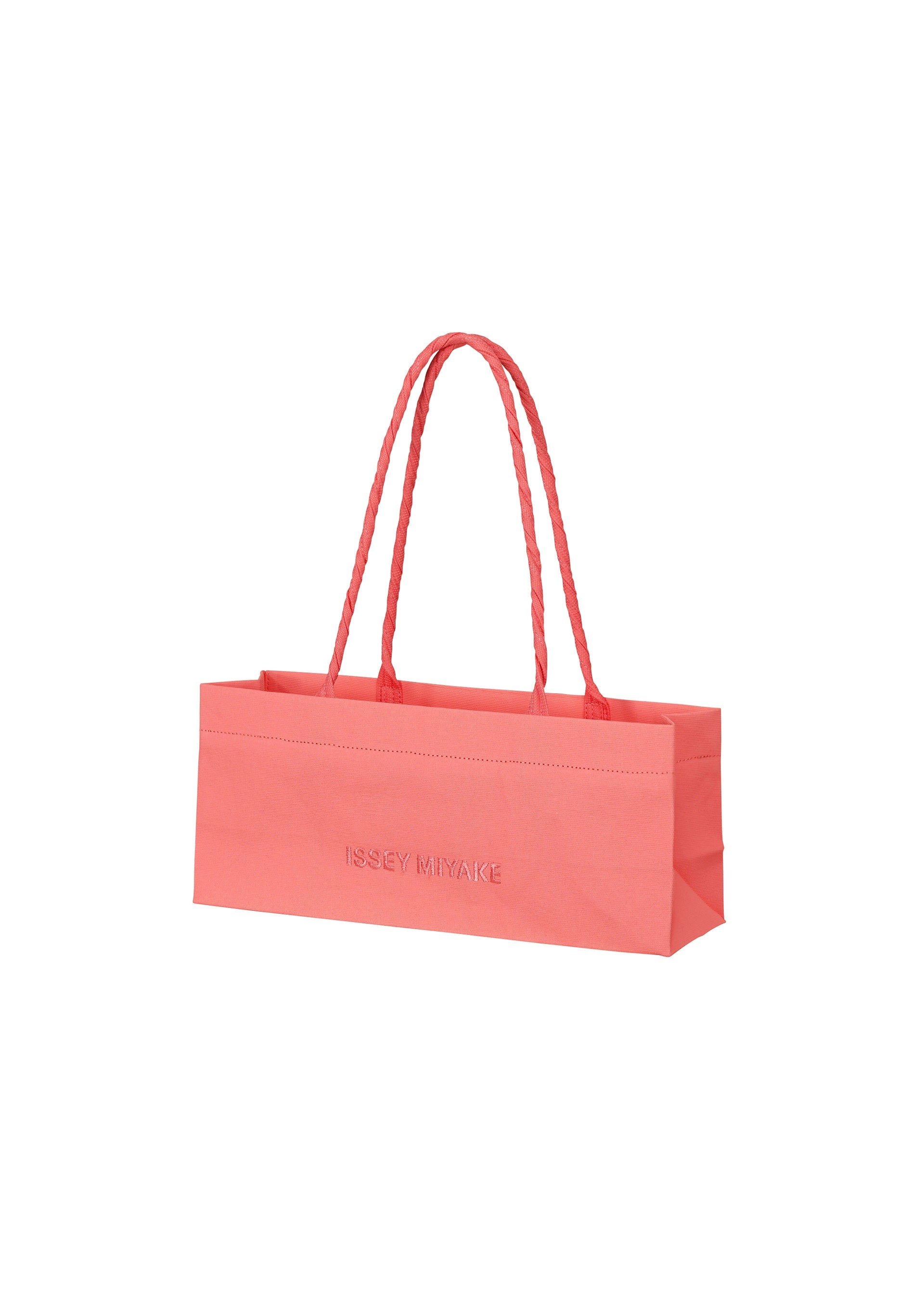 A product shot of the ISSEY MIYAKE THIS IS A PAPER BAG bag in coral (23).