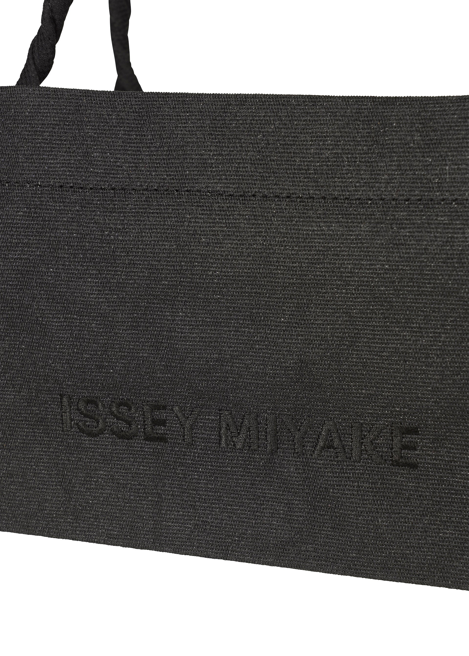 A detail shot of the ISSEY MIYAKE THIS IS A PAPER BAG bag.