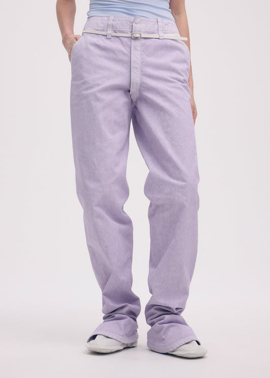 A model wears the ISSEY MIYAKE SOLID LEATHER BELT belt.