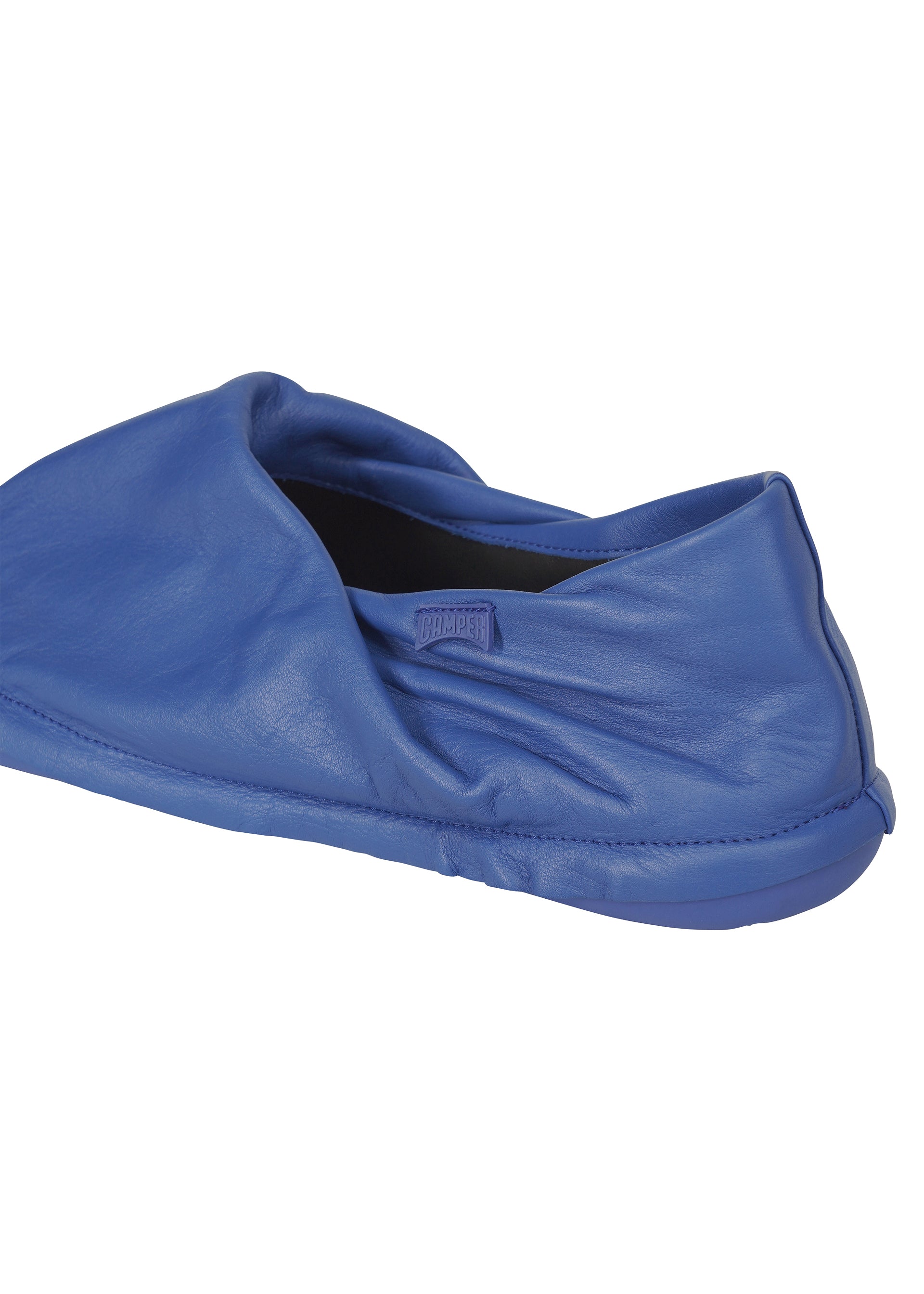 A detail shot of the ISSEY MIYAKE PEU FORM shoes.