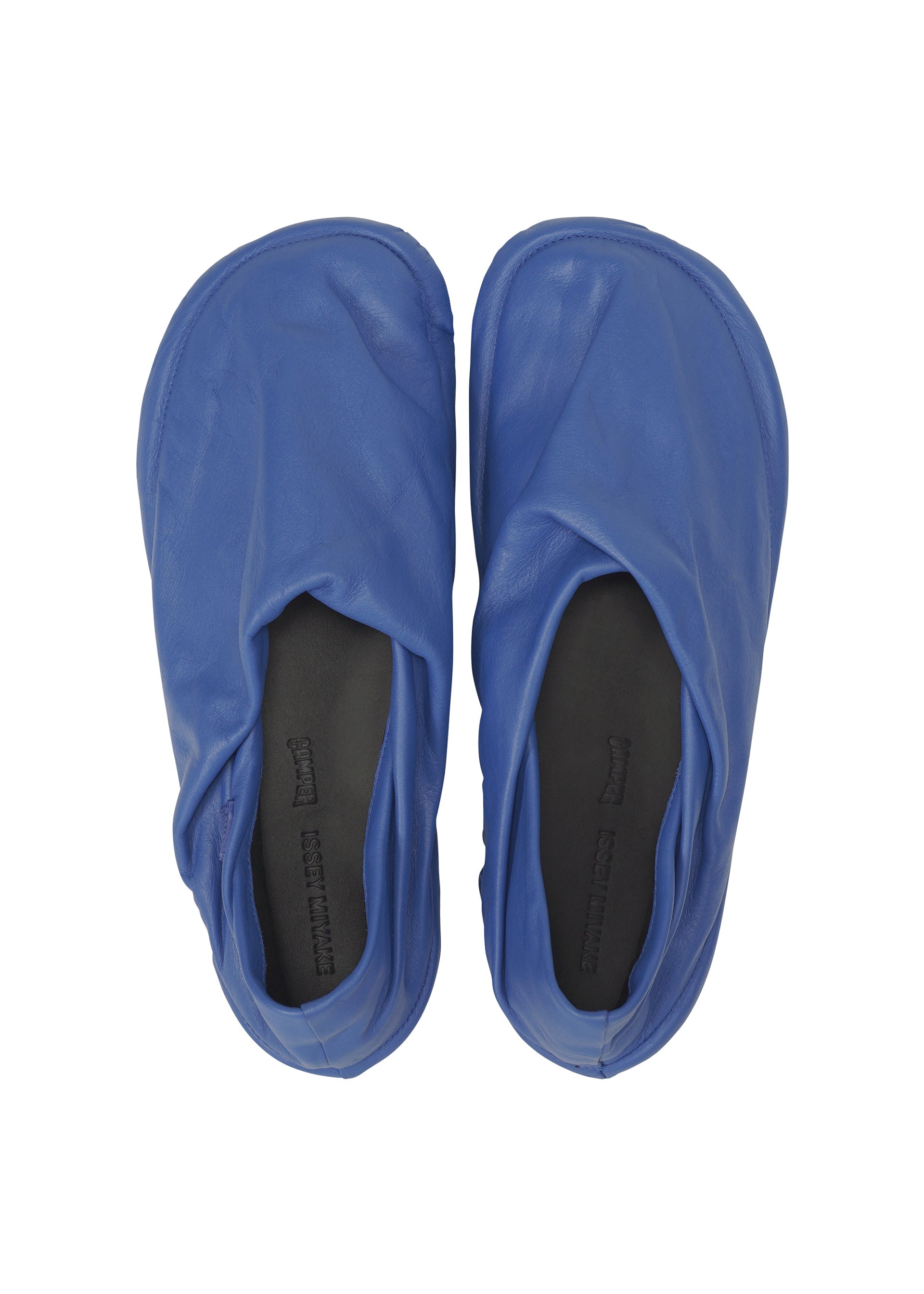 A detail shot of the ISSEY MIYAKE PEU FORM shoes.