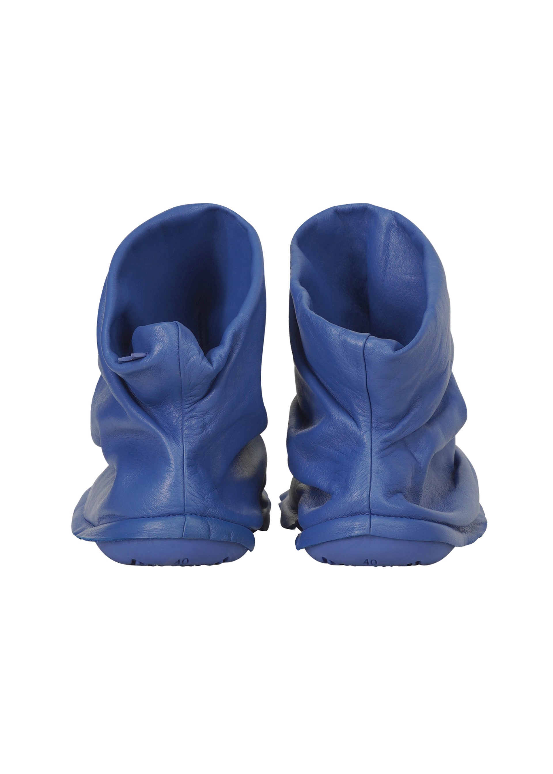 A detail shot of the ISSEY MIYAKE PEU FORM shoes.