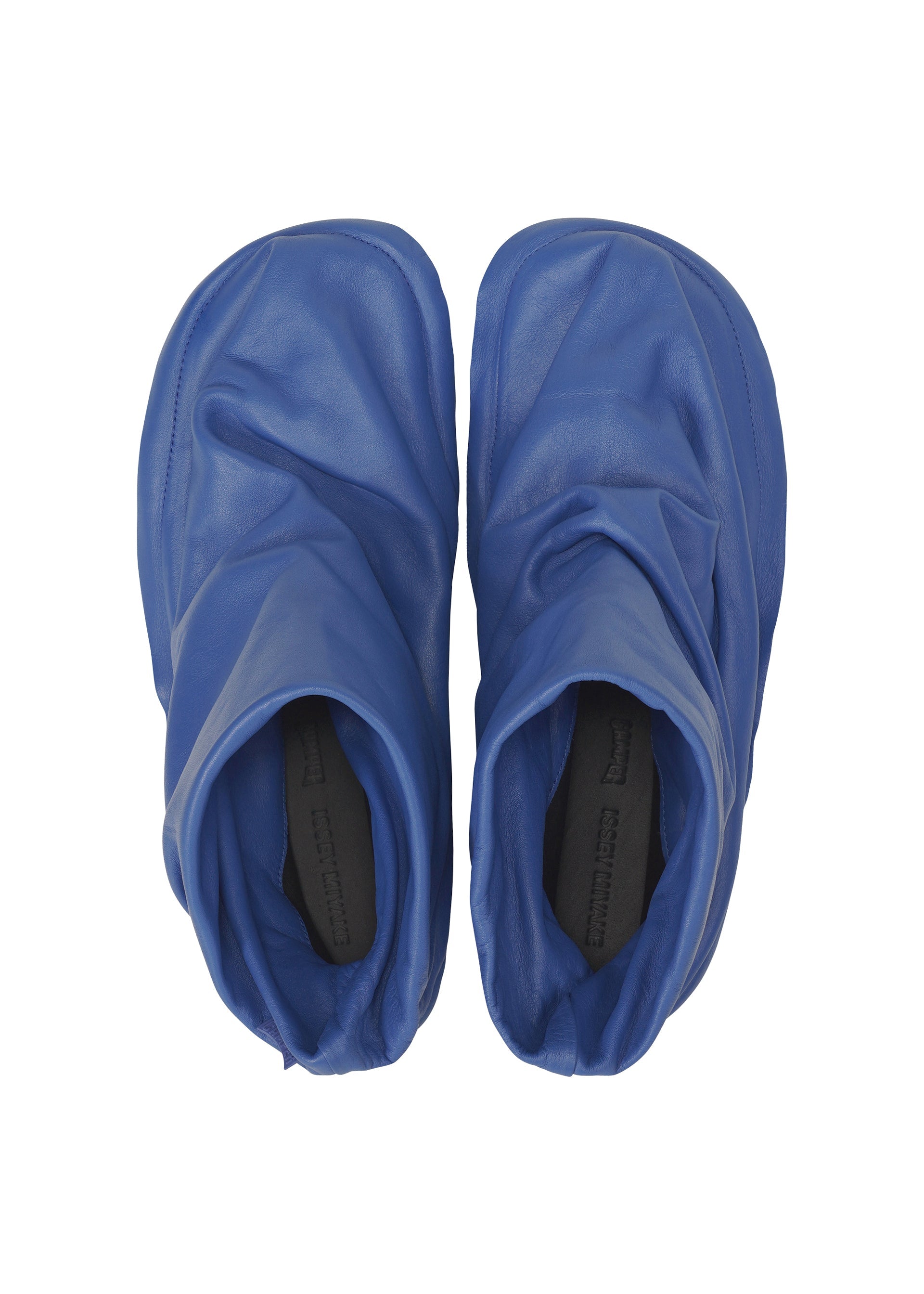 A detail shot of the ISSEY MIYAKE PEU FORM shoes.