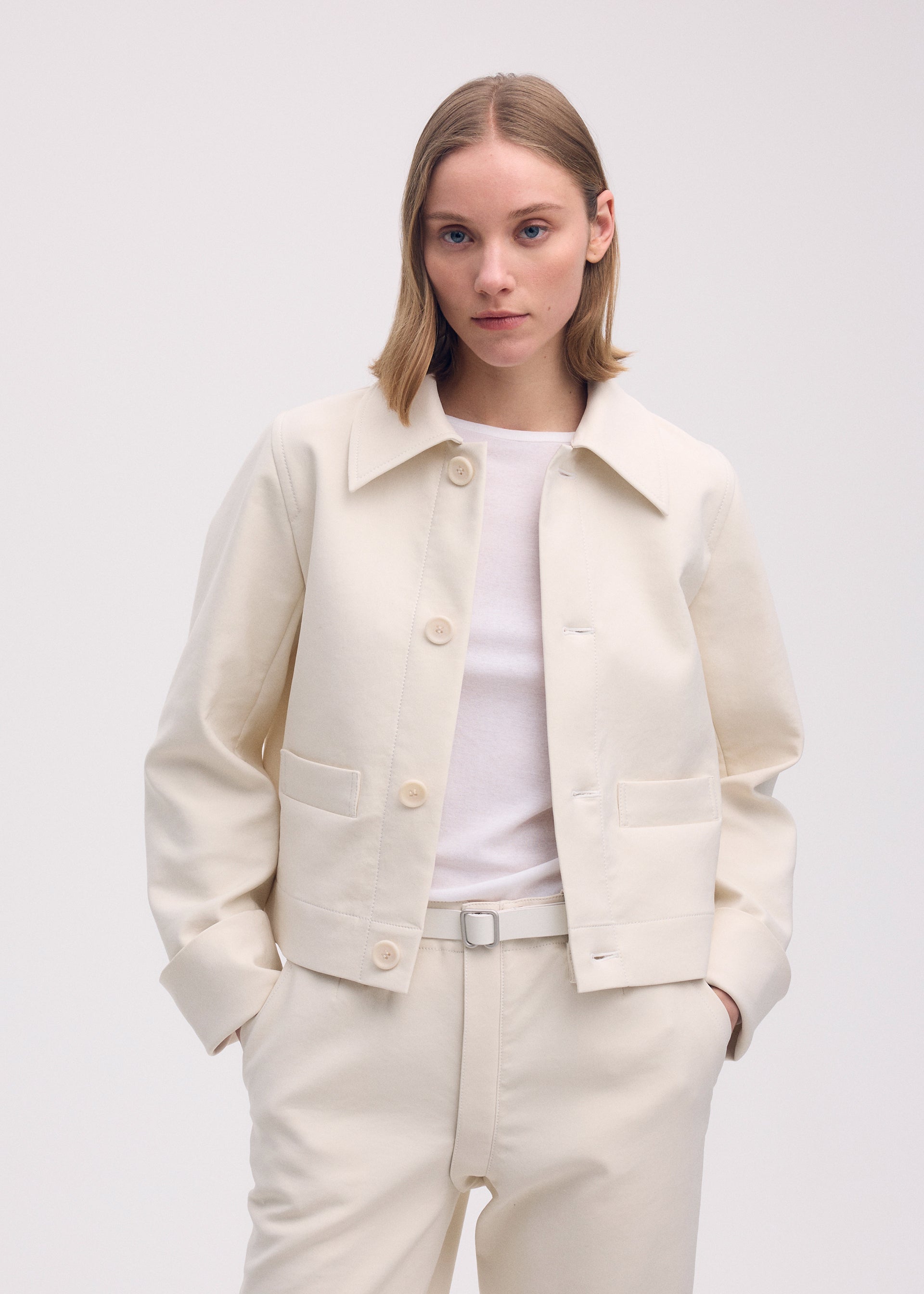 A model wears the ISSEY MIYAKE GYPSUM jacket.