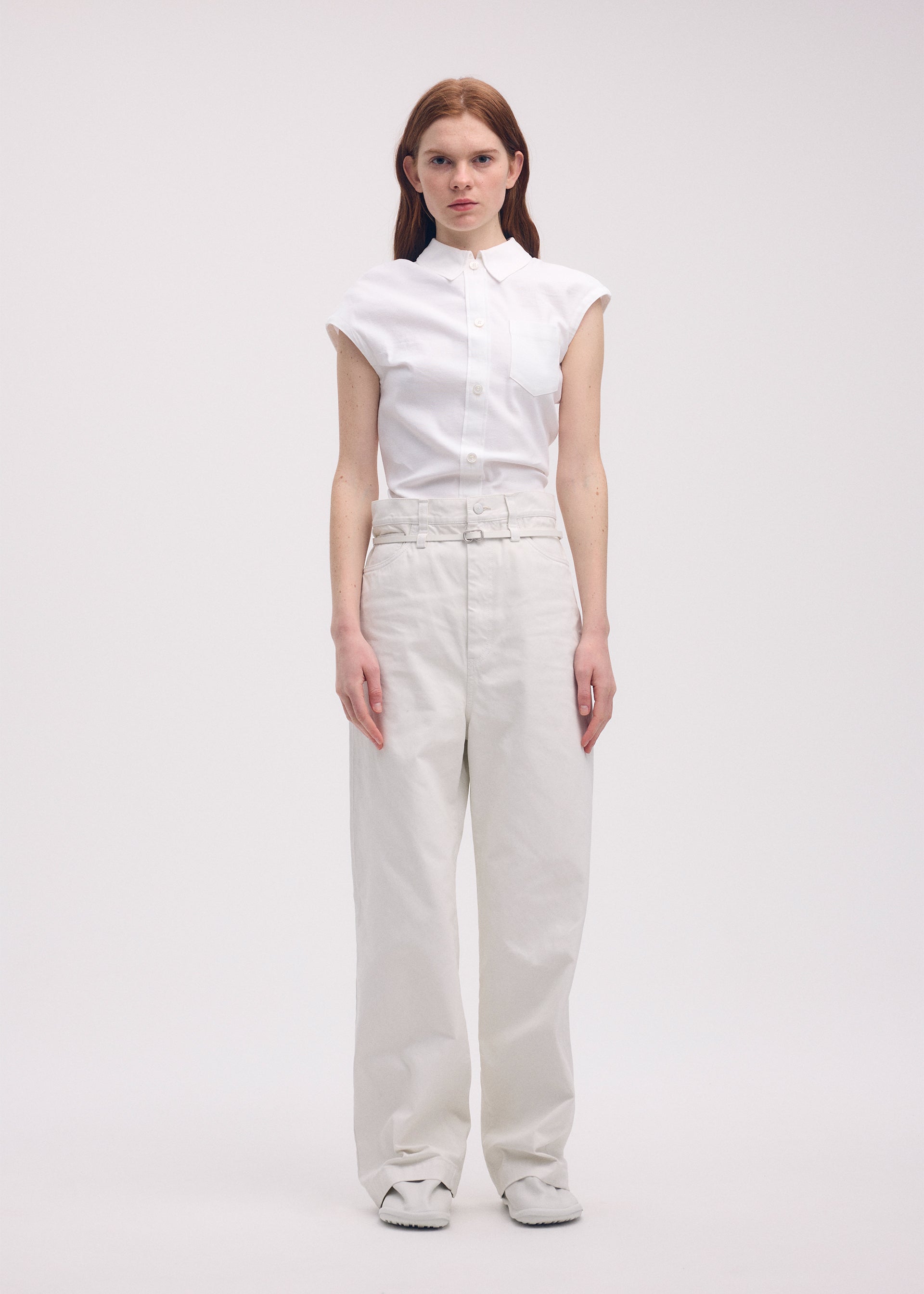 A model wears the ISSEY MIYAKE SCULPTURAL trousers.