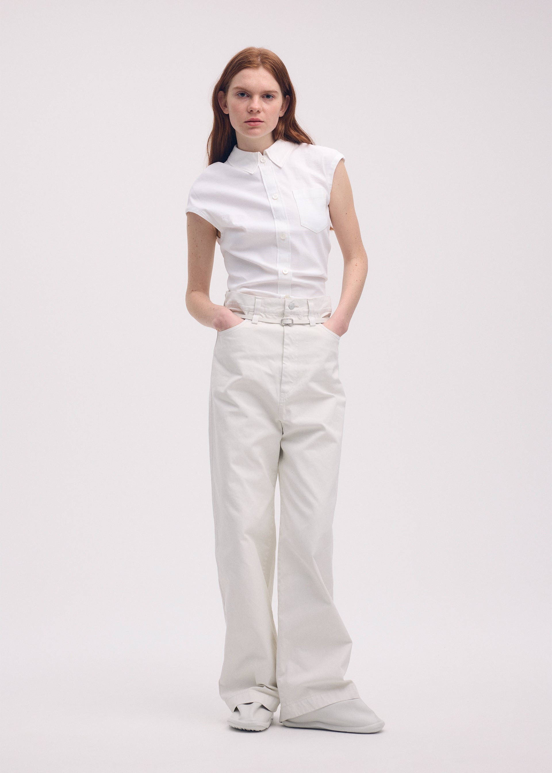 A model wears the ISSEY MIYAKE SCULPTURAL trousers.
