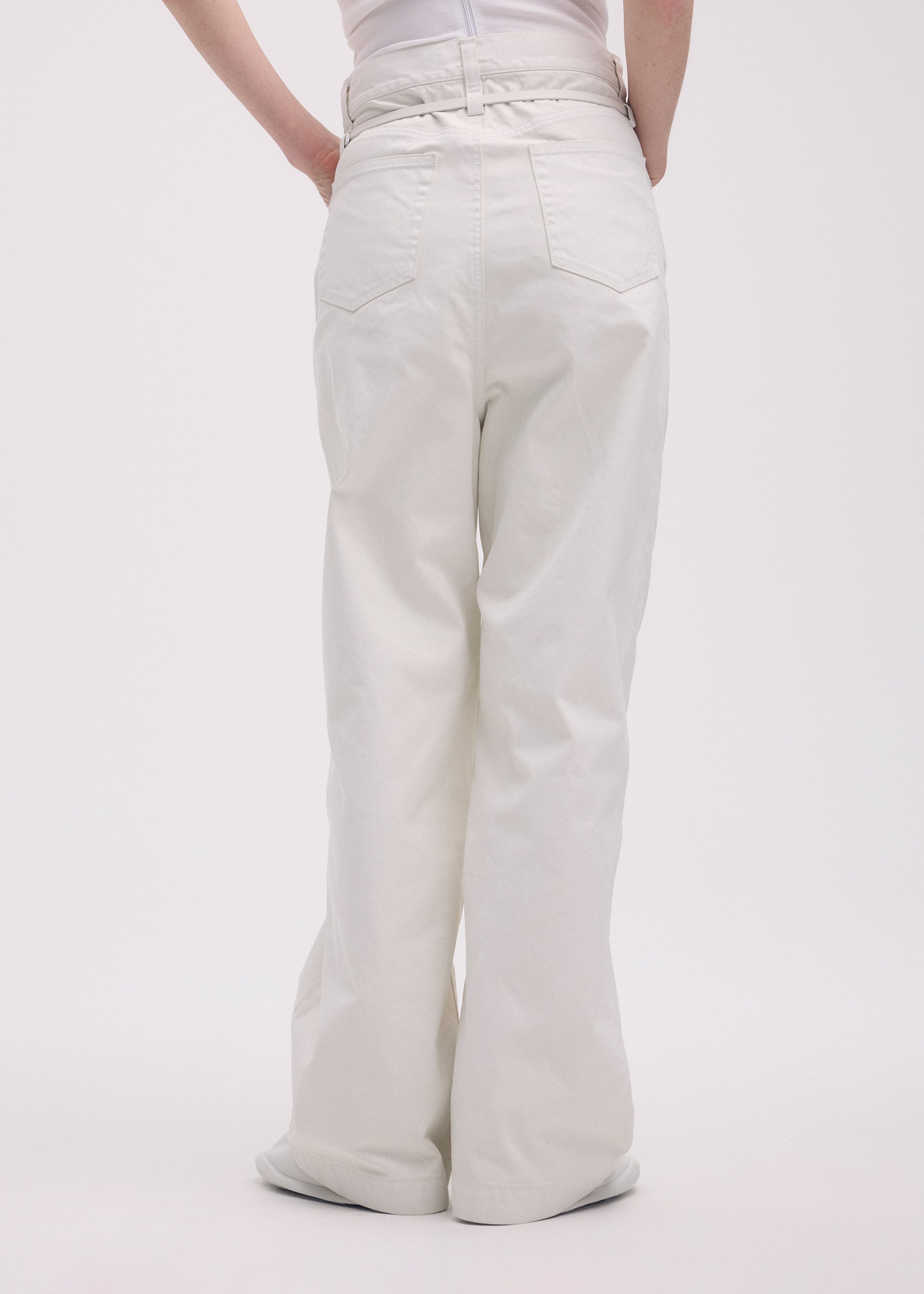 A model wears the ISSEY MIYAKE SCULPTURAL trousers.
