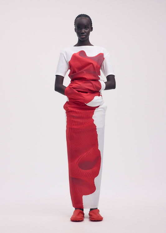 A model wears the ISSEY MIYAKE KNIT (AS REPRESENTED) skirt.