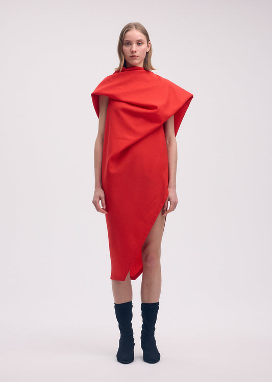 A model wears the ISSEY MIYAKE UNI FORM (WOOL) dress.
