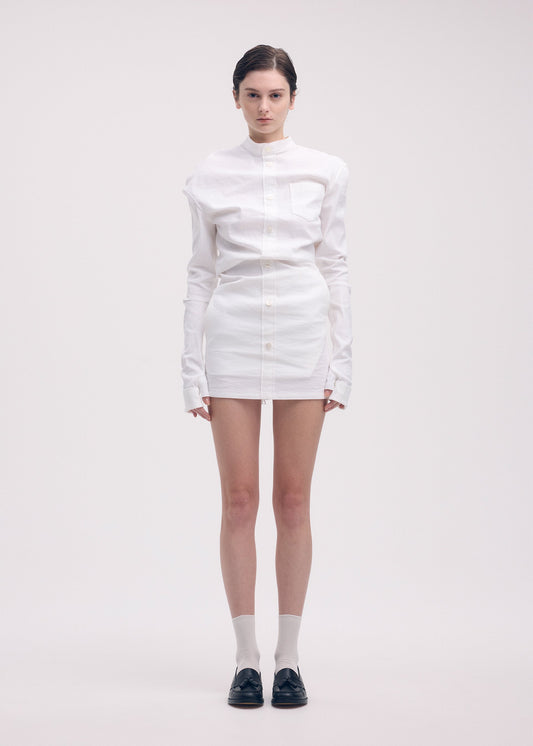 A model wears the ISSEY MIYAKE LIKE TORSO LIKE SHIRT dress.