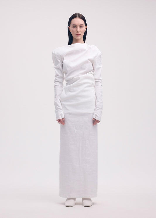 A model wears the ISSEY MIYAKE LIKE TORSO LIKE SHIRT dress.