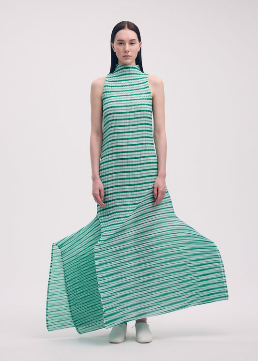 A model wears the ISSEY MIYAKE GENERIC STRIPES (MACHINE PLEATS) clothing.