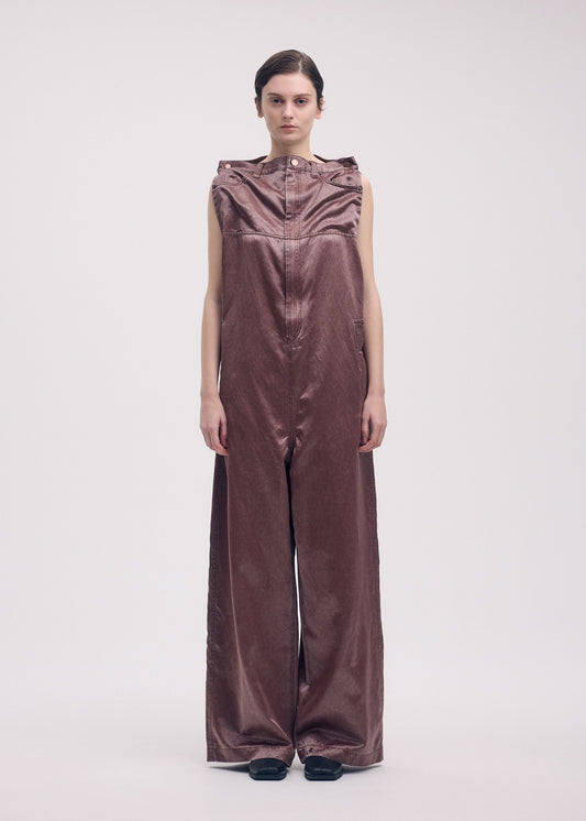 A model wears the ISSEY MIYAKE PSEUDO JEANS jumpsuit.