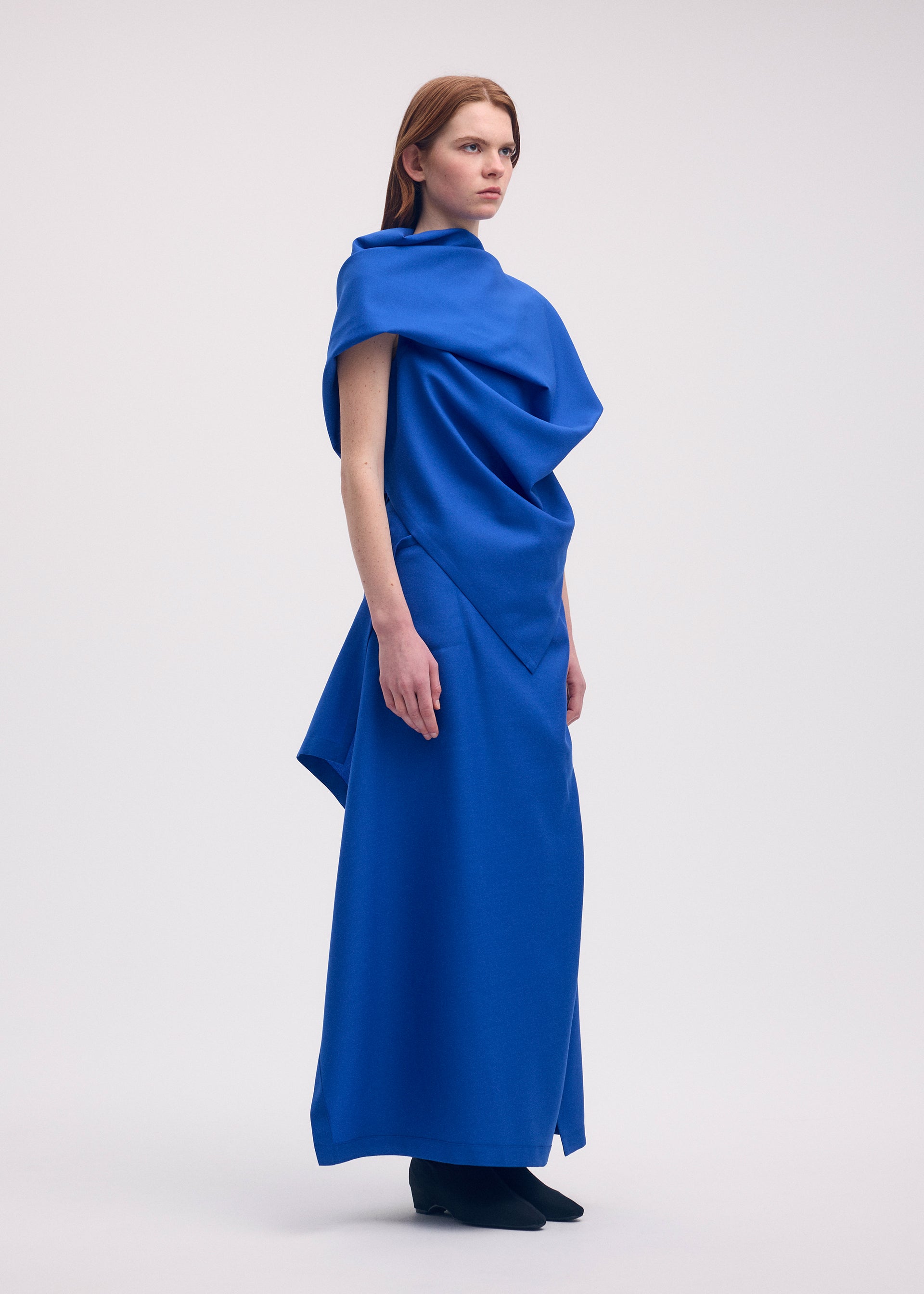 A model wears the ISSEY MIYAKE UNI FORM (WOOL) shirt.