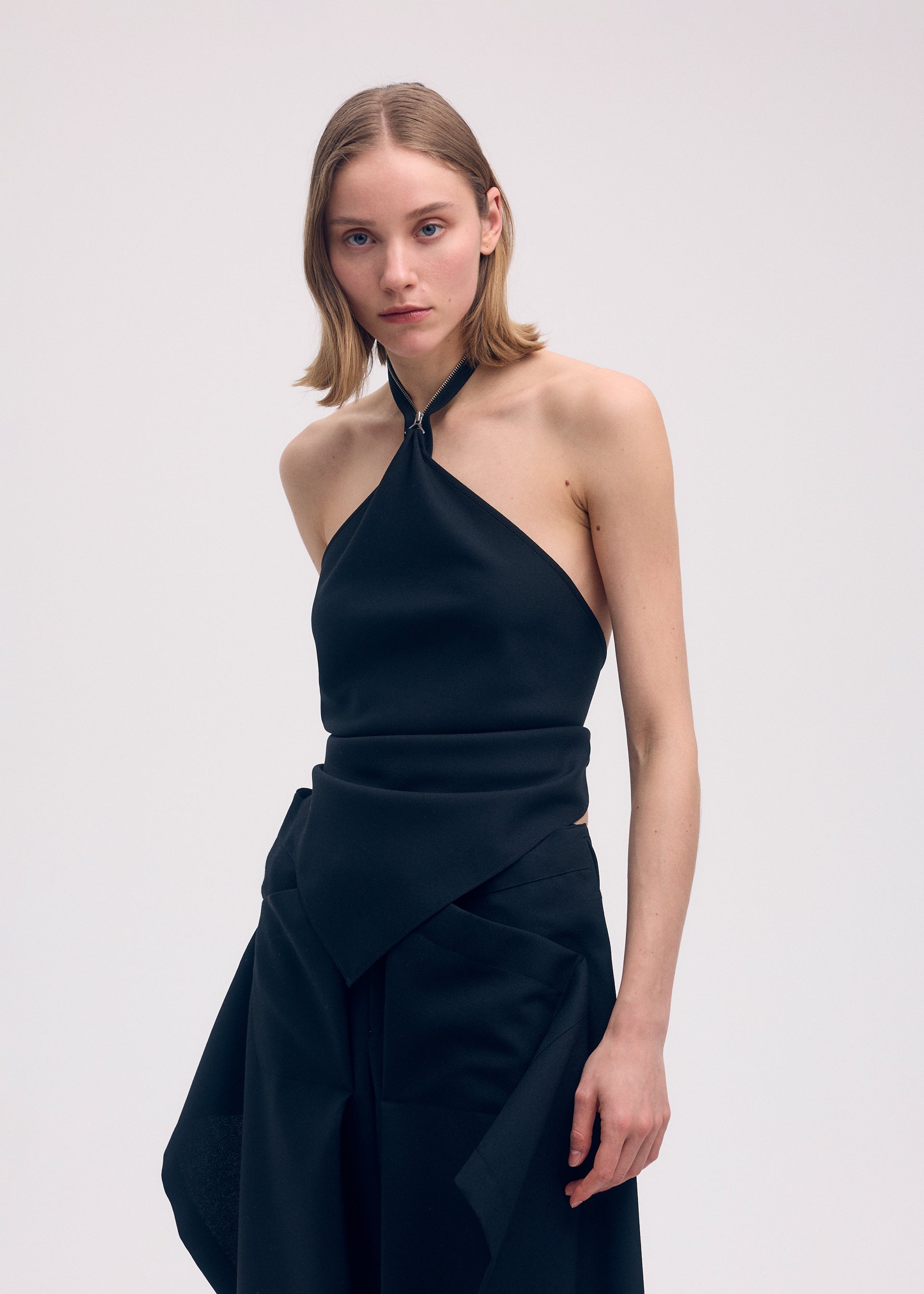 A model wears the ISSEY MIYAKE UNI FORM (WOOL) shirt.
