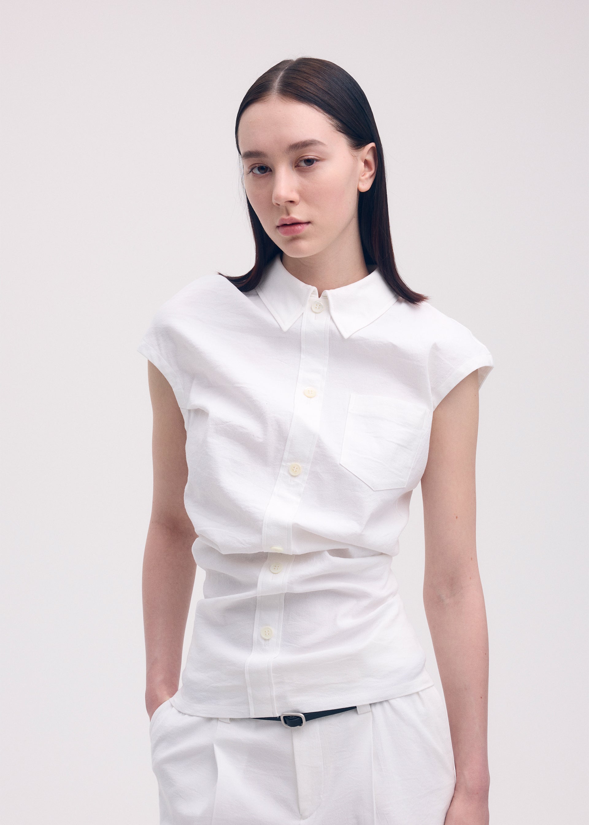 A model wears the ISSEY MIYAKE LIKE TORSO LIKE SHIRT shirt.