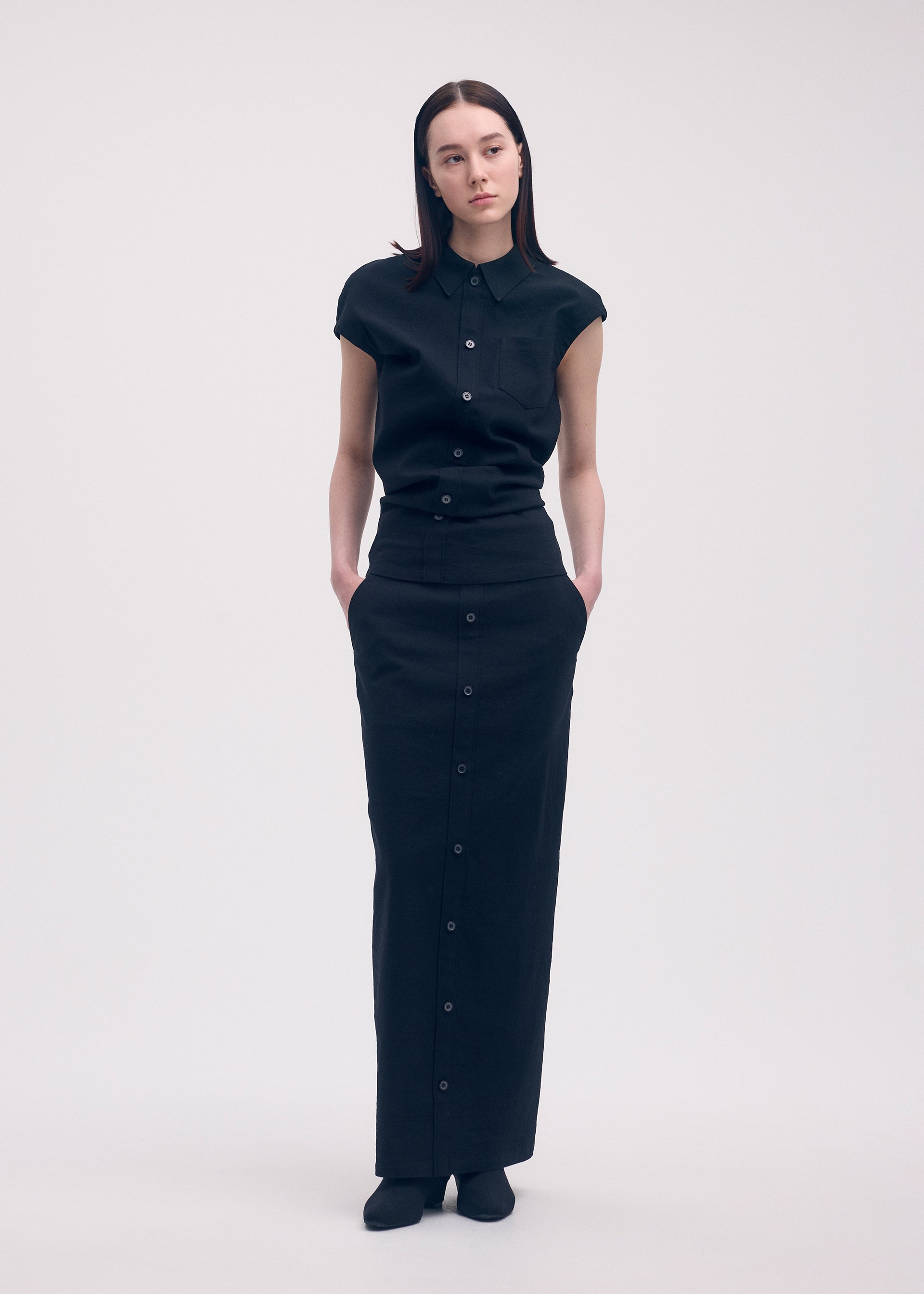 A model wears the ISSEY MIYAKE LIKE TORSO LIKE SHIRT shirt.