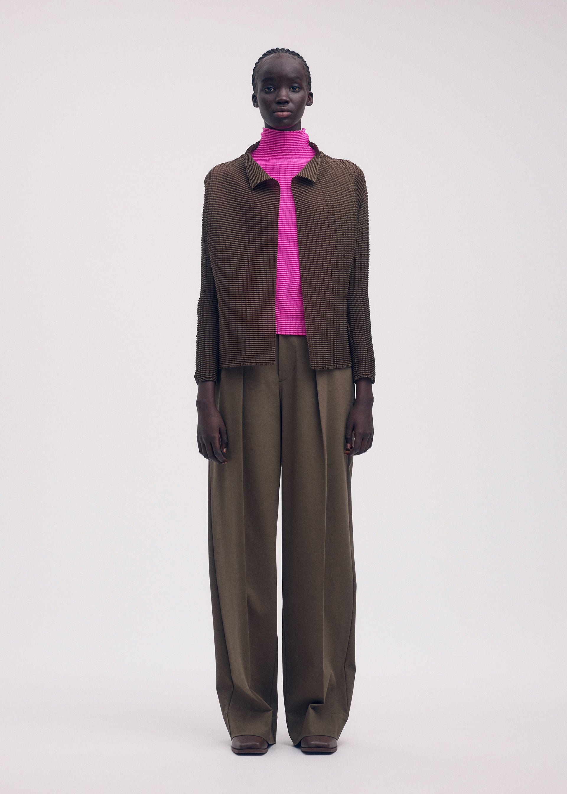 A model wears the ISSEY MIYAKE WOOLY PLEATS 58 shirt.