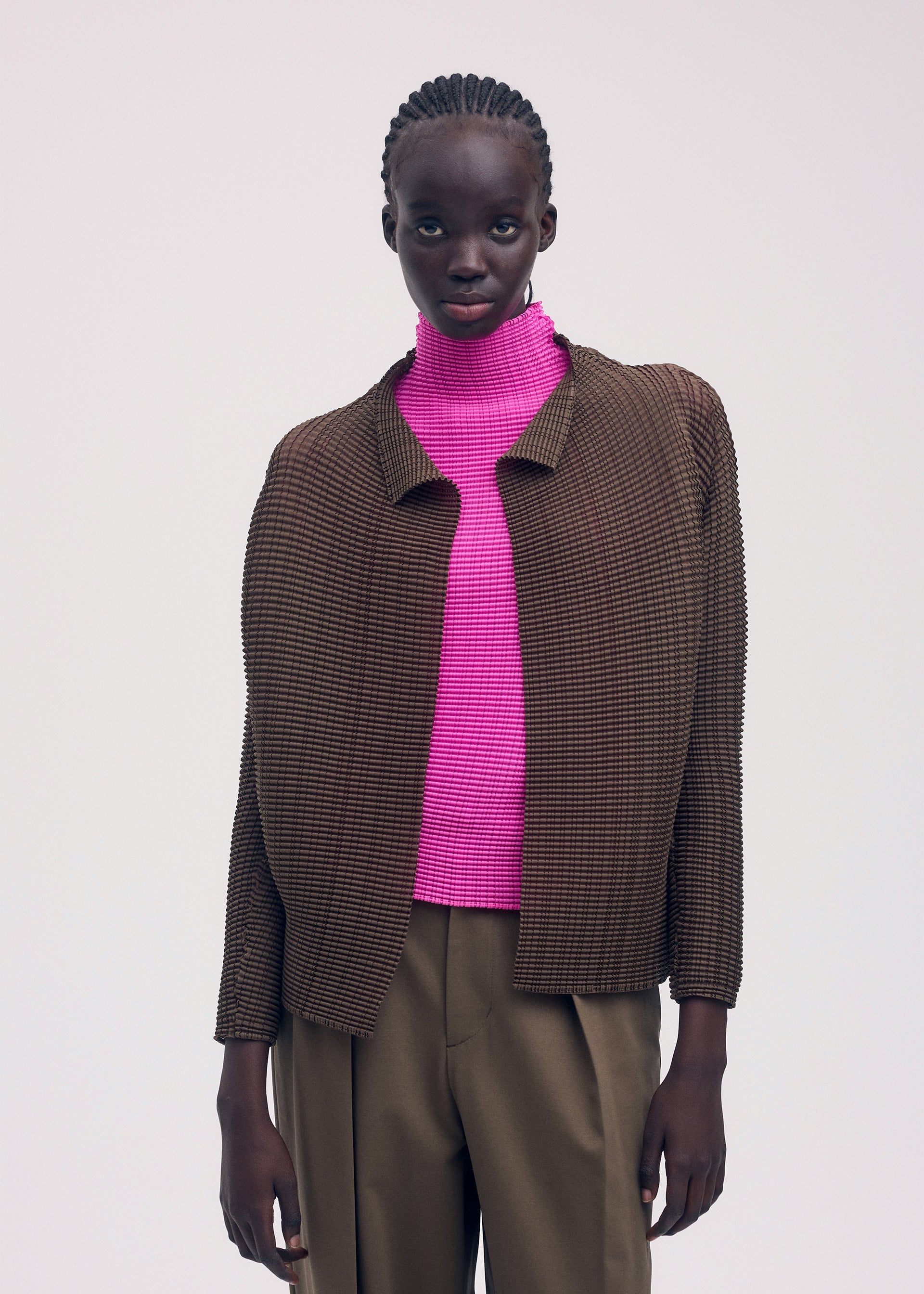 A model wears the ISSEY MIYAKE WOOLY PLEATS 58 shirt.